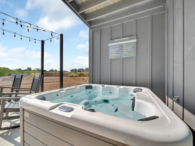 a view of swimming pool with seating space and deck