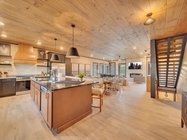 a kitchen with lots of counter top space and wooden floor