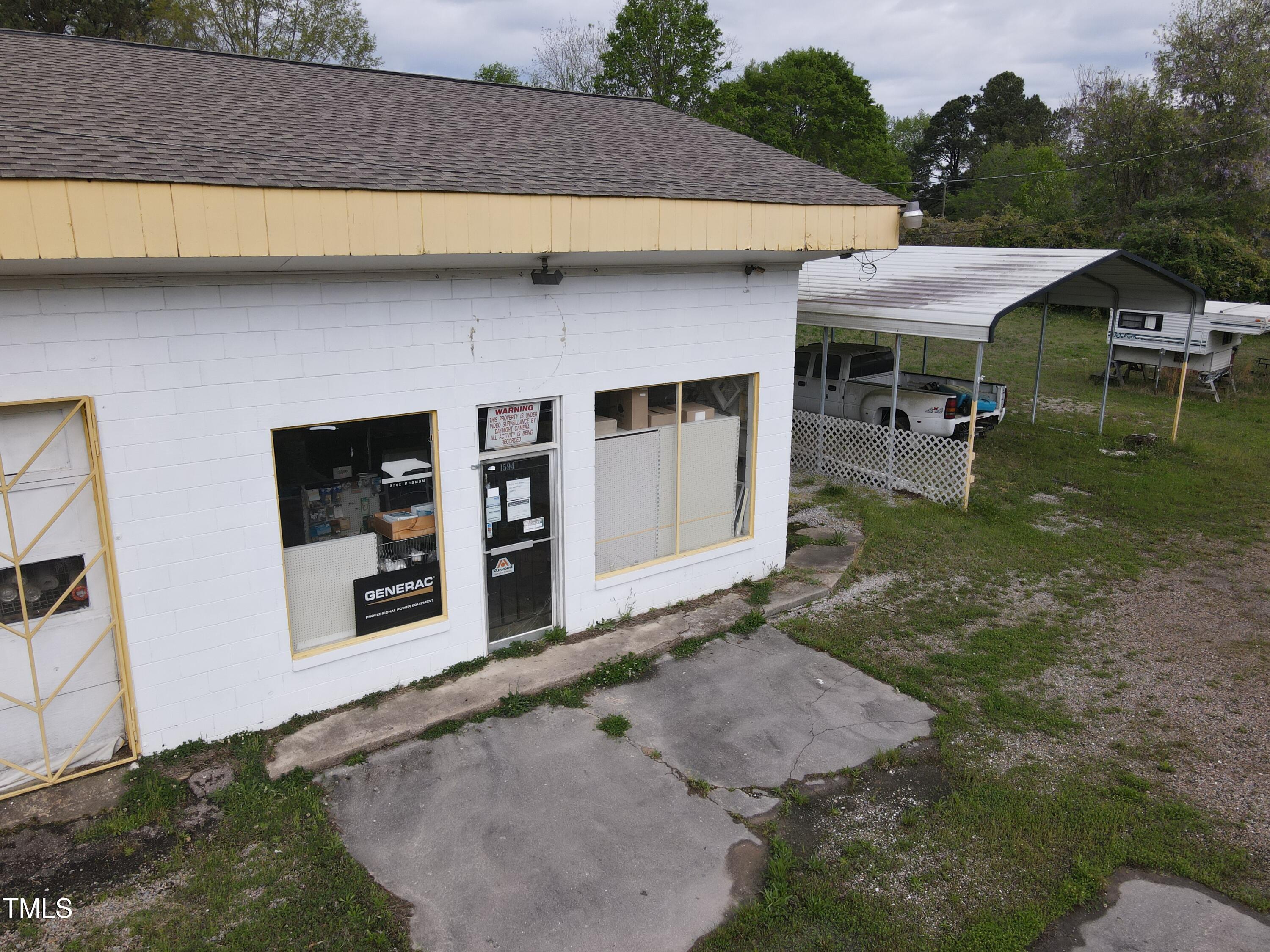 1594 Us Highway Kittrell, NC 27544 - Photo 21 of 24 a front view of a house with garden