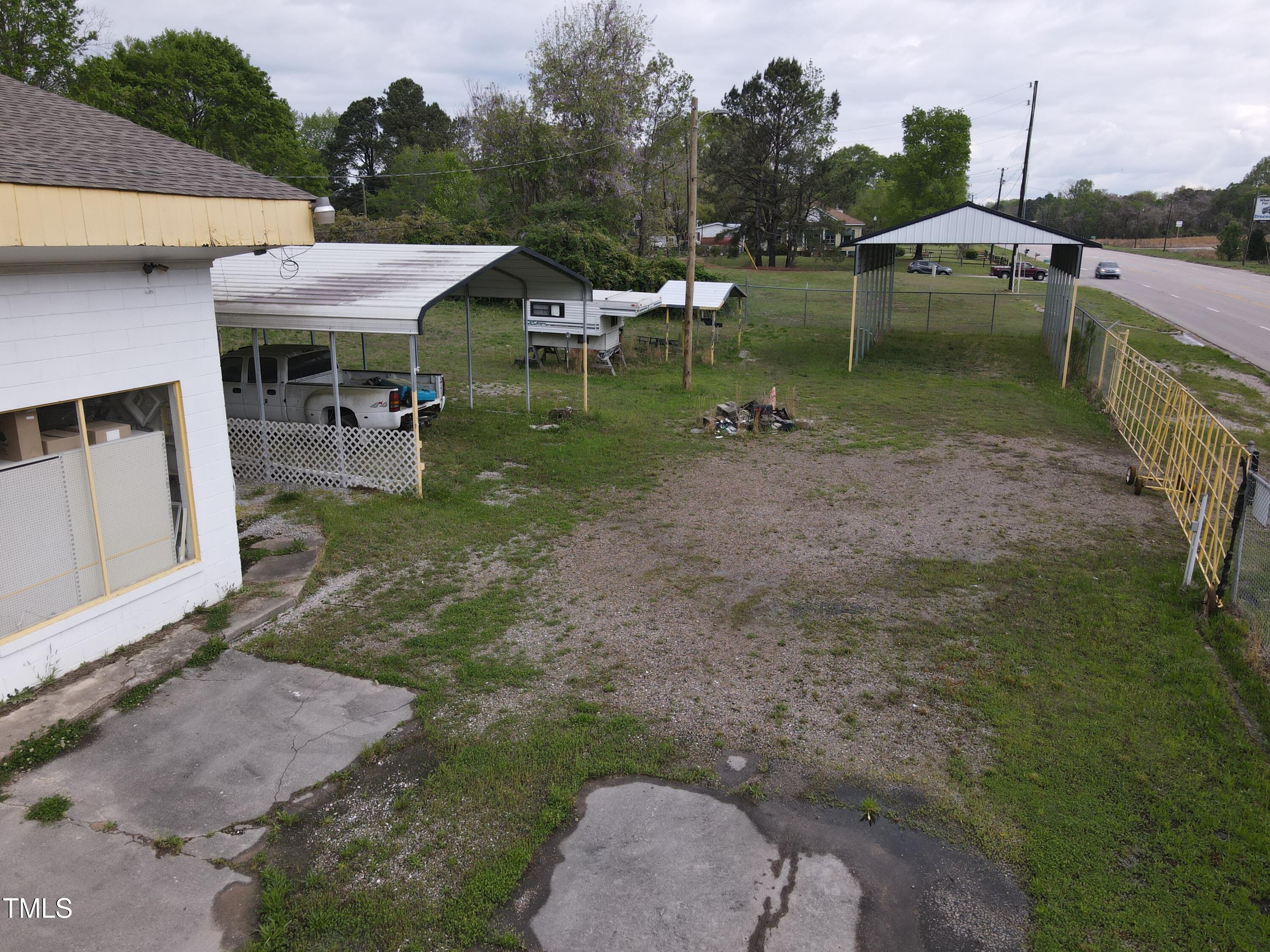 1594 Us Highway Kittrell, NC 27544 - Photo 22 of 24 a view of a patio with table and chairs with wooden fence