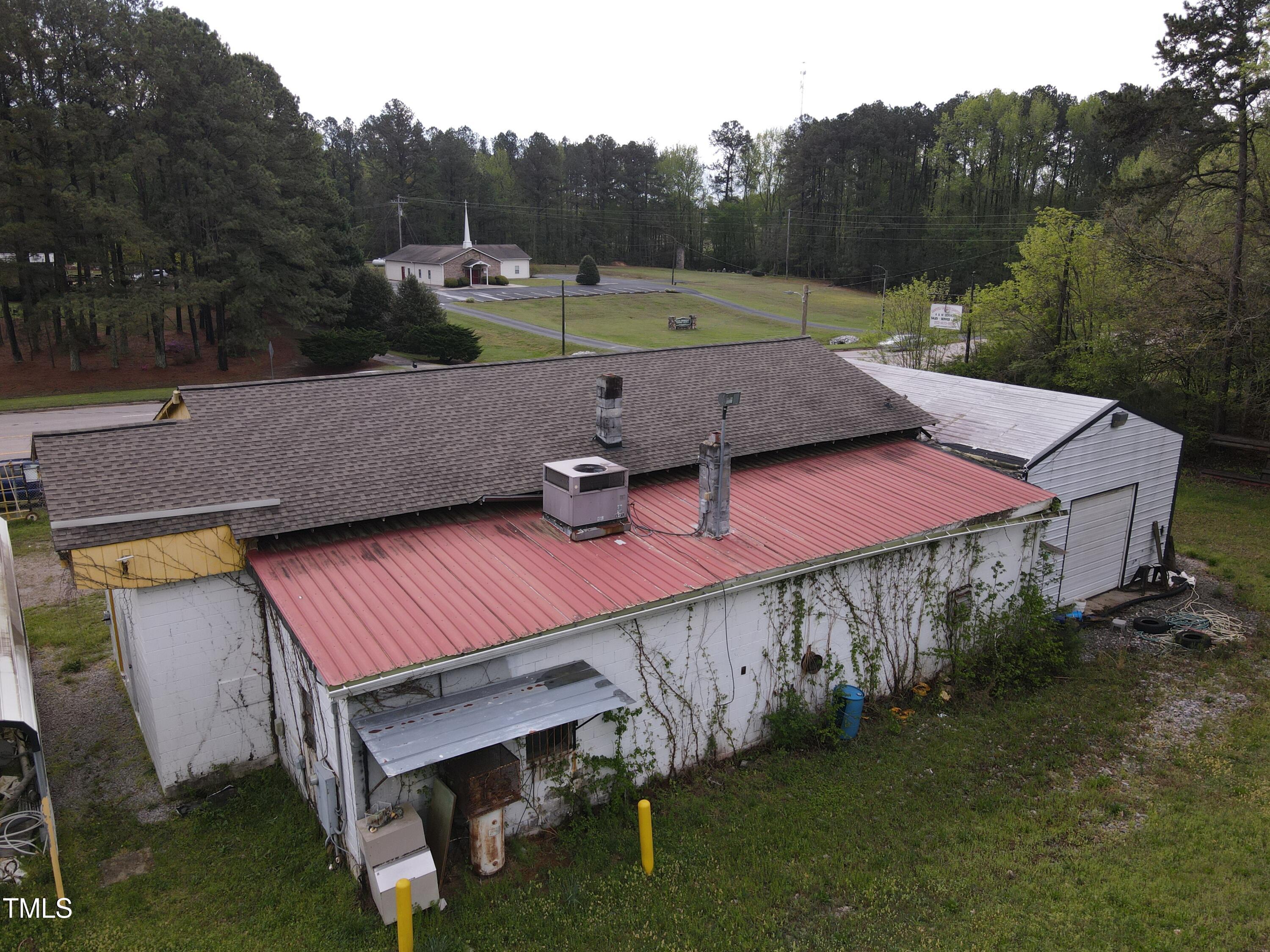 1594 Us Highway Kittrell, NC 27544 - Photo 23 of 24 a view of a patio with a table chairs and a fire pit