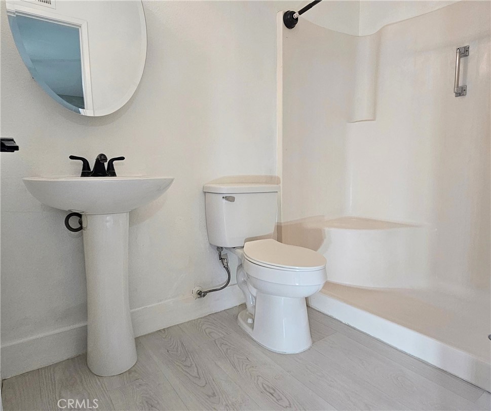 6172 Ave Juan Diaz Riverside, CA 92509 - Photo 11 of 20 a white toilet sitting next to a white sink