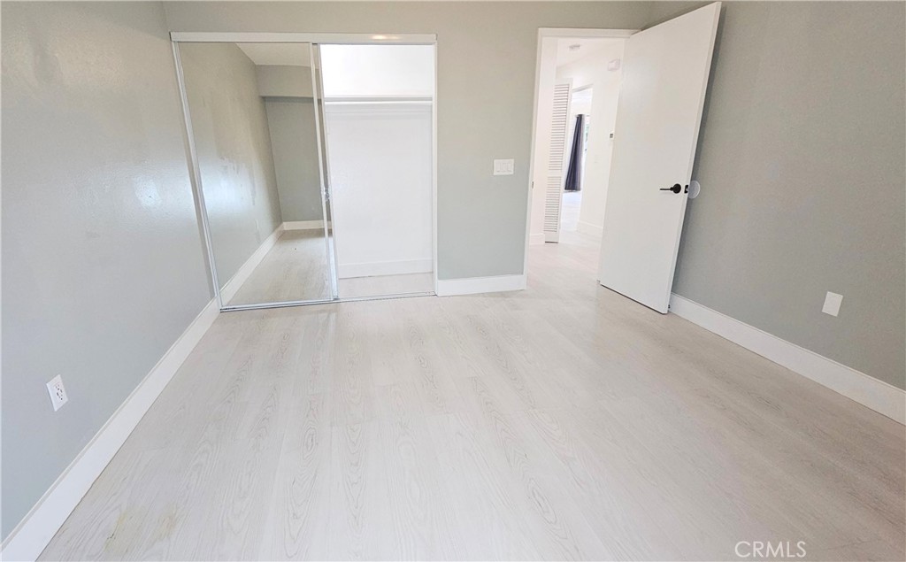 6172 Ave Juan Diaz Riverside, CA 92509 - Photo 13 of 20 wooden floor in an empty room with a mirror