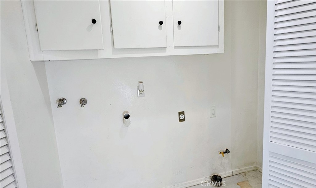 6172 Ave Juan Diaz Riverside, CA 92509 - Photo 8 of 20 a bathroom with cabinet a mirror and vanity