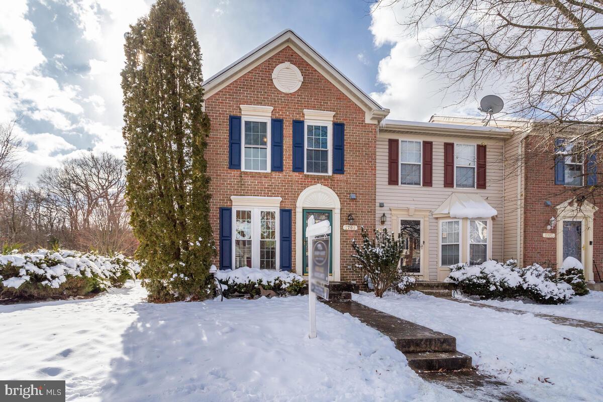 1703 Bluffs Island Court Odenton, MD 21113 - Photo 2 of 38 a front view of a house with a yard