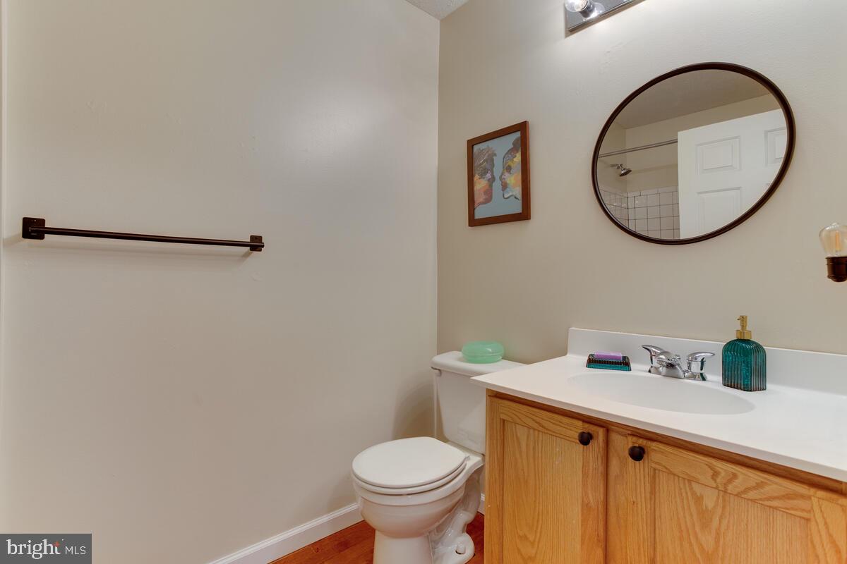 1703 Bluffs Island Court Odenton, MD 21113 - Photo 23 of 38 a bathroom with a sink and a mirror