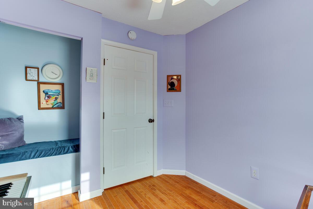 1703 Bluffs Island Court Odenton, MD 21113 - Photo 26 of 38 a view of empty room with wooden floor