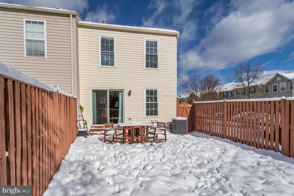 1703 Bluffs Island Court Odenton, MD 21113 - Photo 31 of 38 a view of a house with wooden fence
