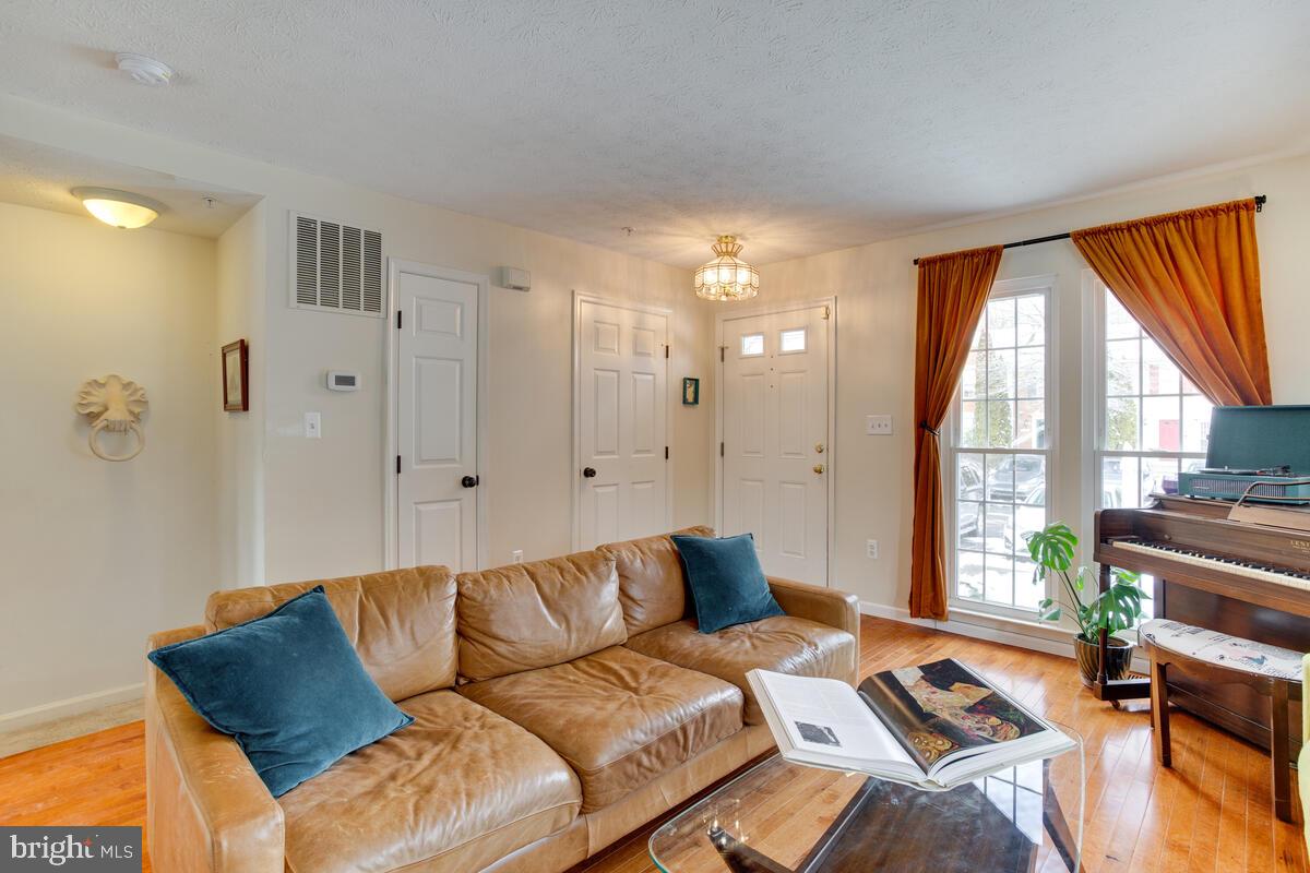 1703 Bluffs Island Court Odenton, MD 21113 - Photo 6 of 38 a living room with furniture and a large window