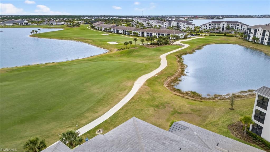 43985 Boardwalk Loop, Unit 2115 Punta Gorda, FL 33982 - Photo 25 of 28 a view of a swimming pool with a lake