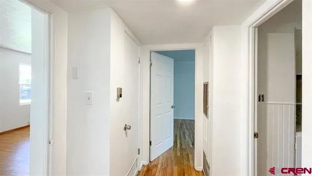 a view of a bathroom from a hallway