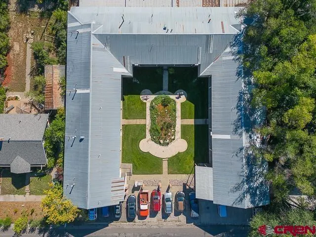 an aerial view of a house with yard swimming pool and outdoor seating