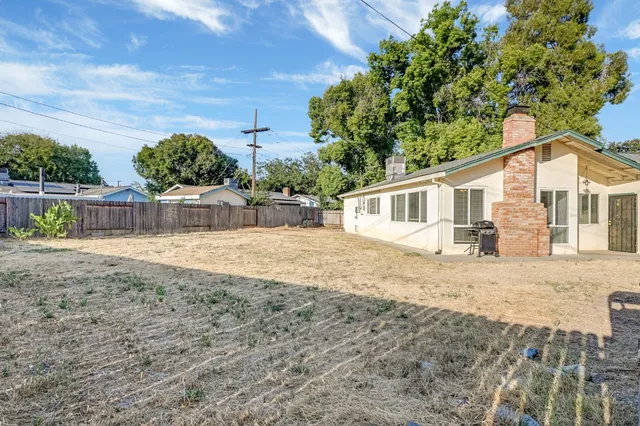 a house with trees in the background