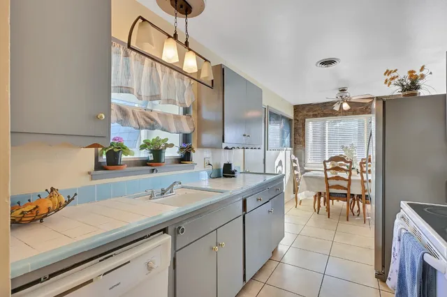a kitchen with a sink and cabinets