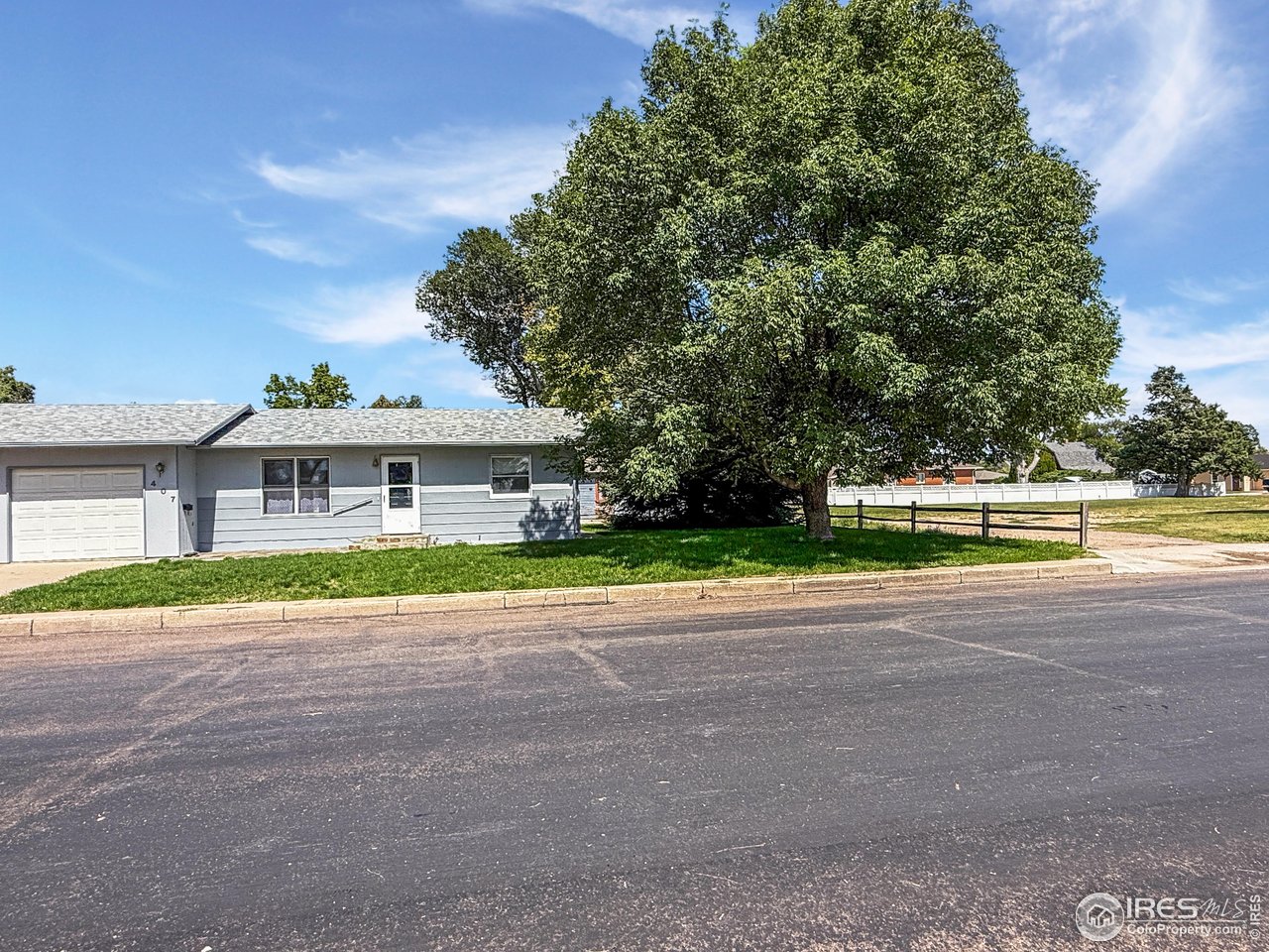 407 East Gordon Street Holyoke, CO 80734 - Photo 1 of 15 a front view of house with yard and green space