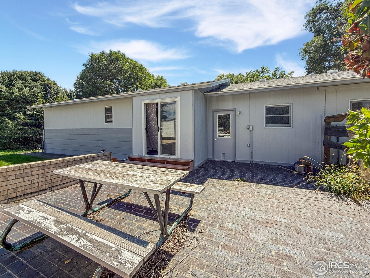 407 East Gordon Street Holyoke, CO 80734 - Photo 12 of 15 a view of a house with backyard and sitting area