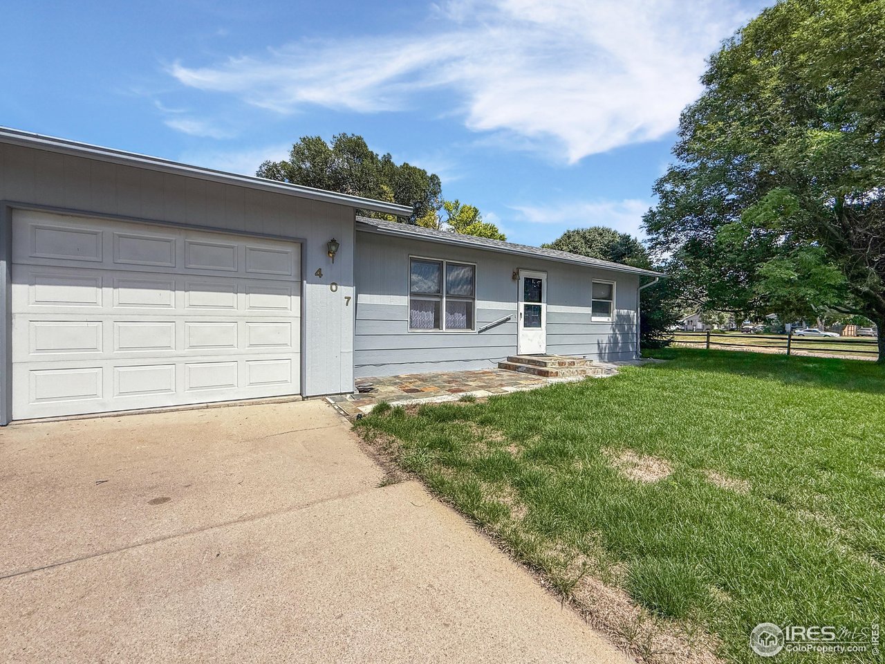 407 East Gordon Street Holyoke, CO 80734 - Photo 2 of 15 a front view of house with yard and green space