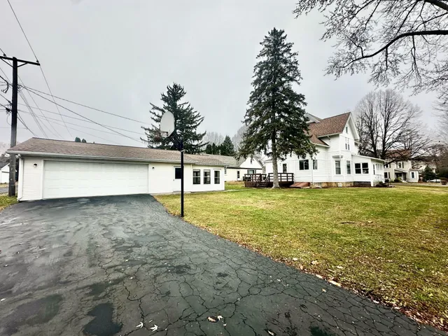 a view of a swimming pool with a yard