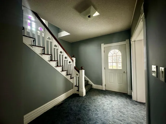 a view of entryway with stairs