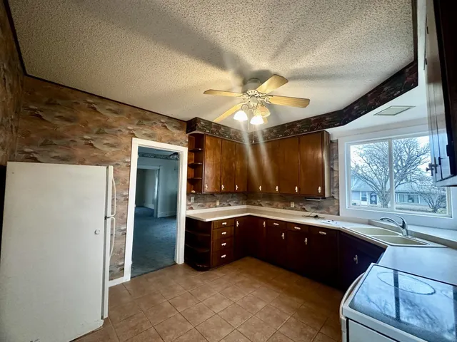 a large bathroom with a large tub and sink