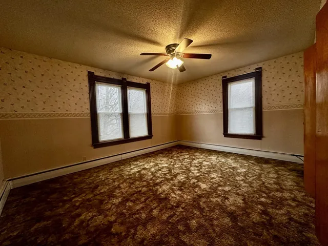 a view of an empty room and window