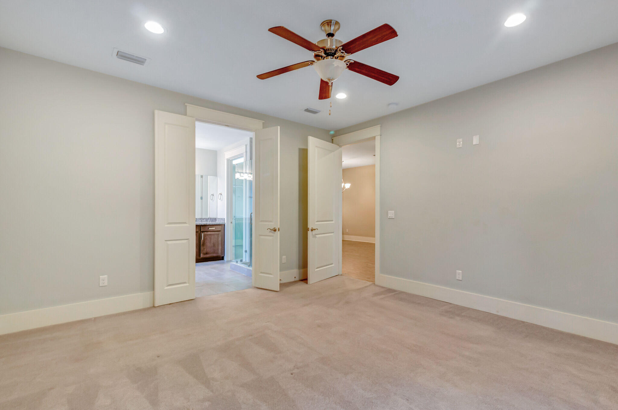 4232 Jade Loop Destin, FL 32541 - Photo 15 of 34 an empty room with closet and a ceiling fan