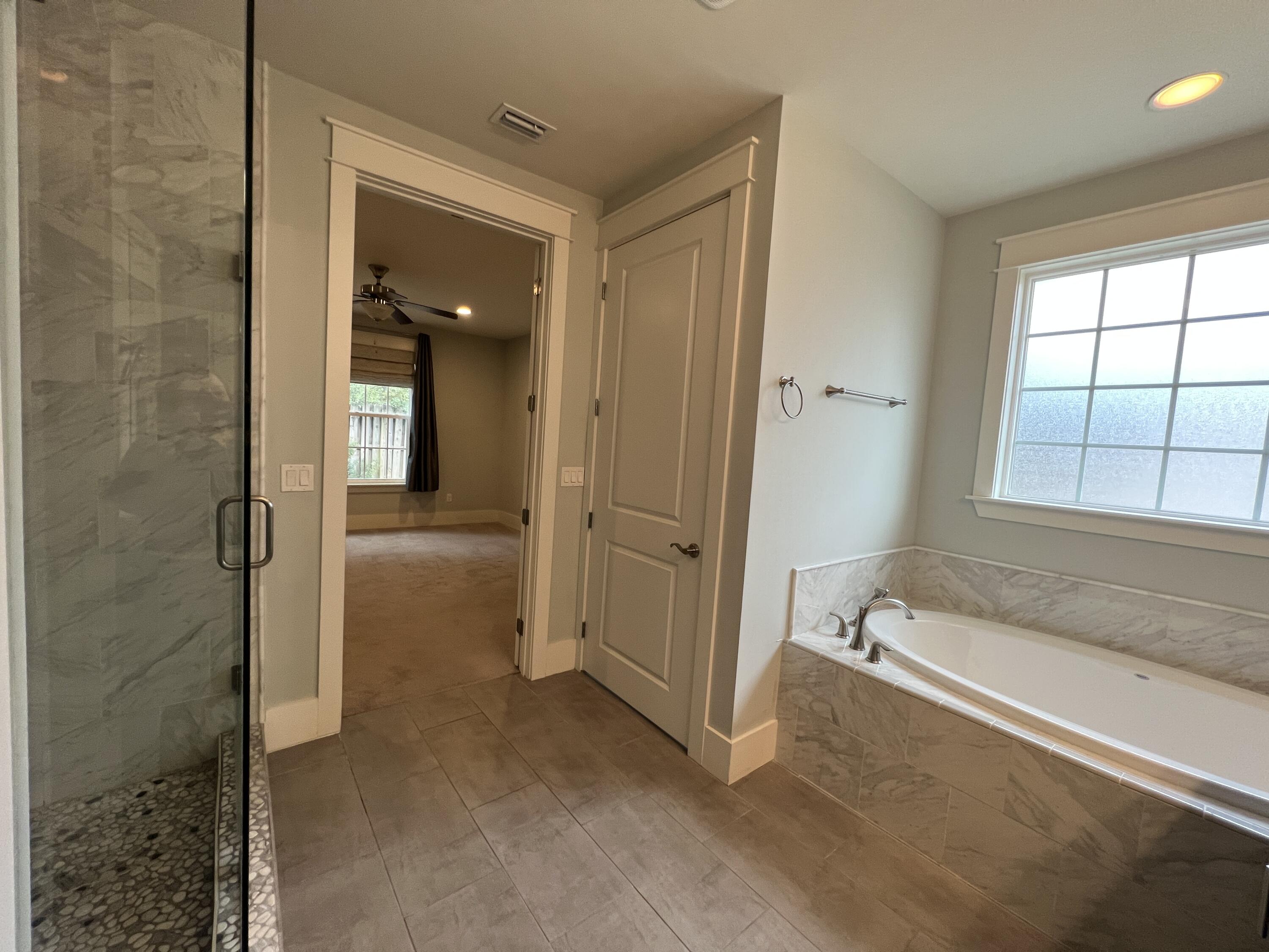 4232 Jade Loop Destin, FL 32541 - Photo 19 of 34 an empty room with windows