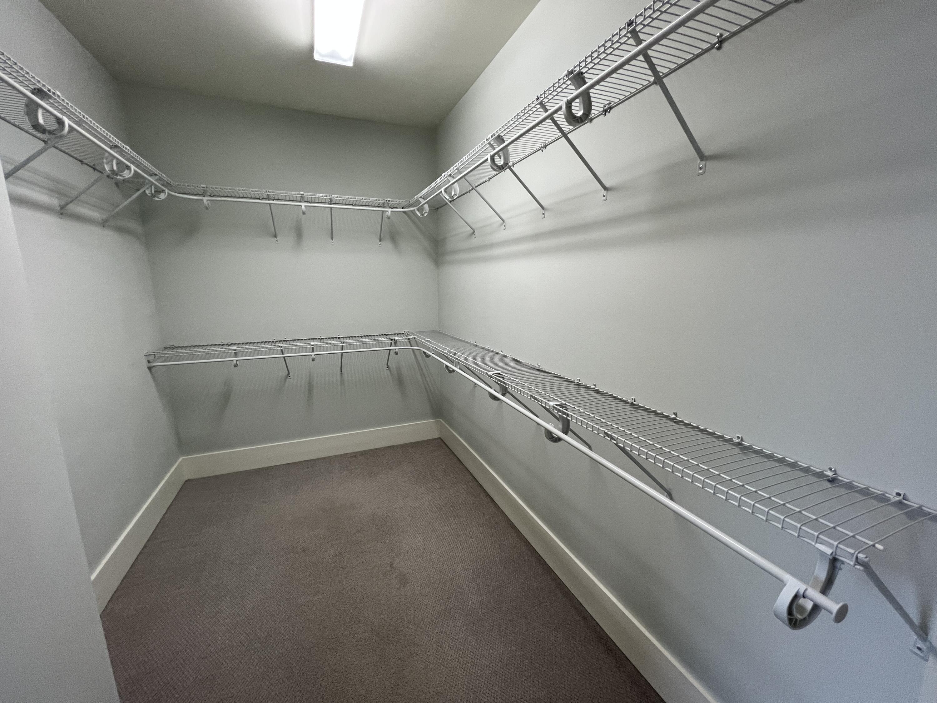 4232 Jade Loop Destin, FL 32541 - Photo 20 of 34 a view of a room with racks on the wall