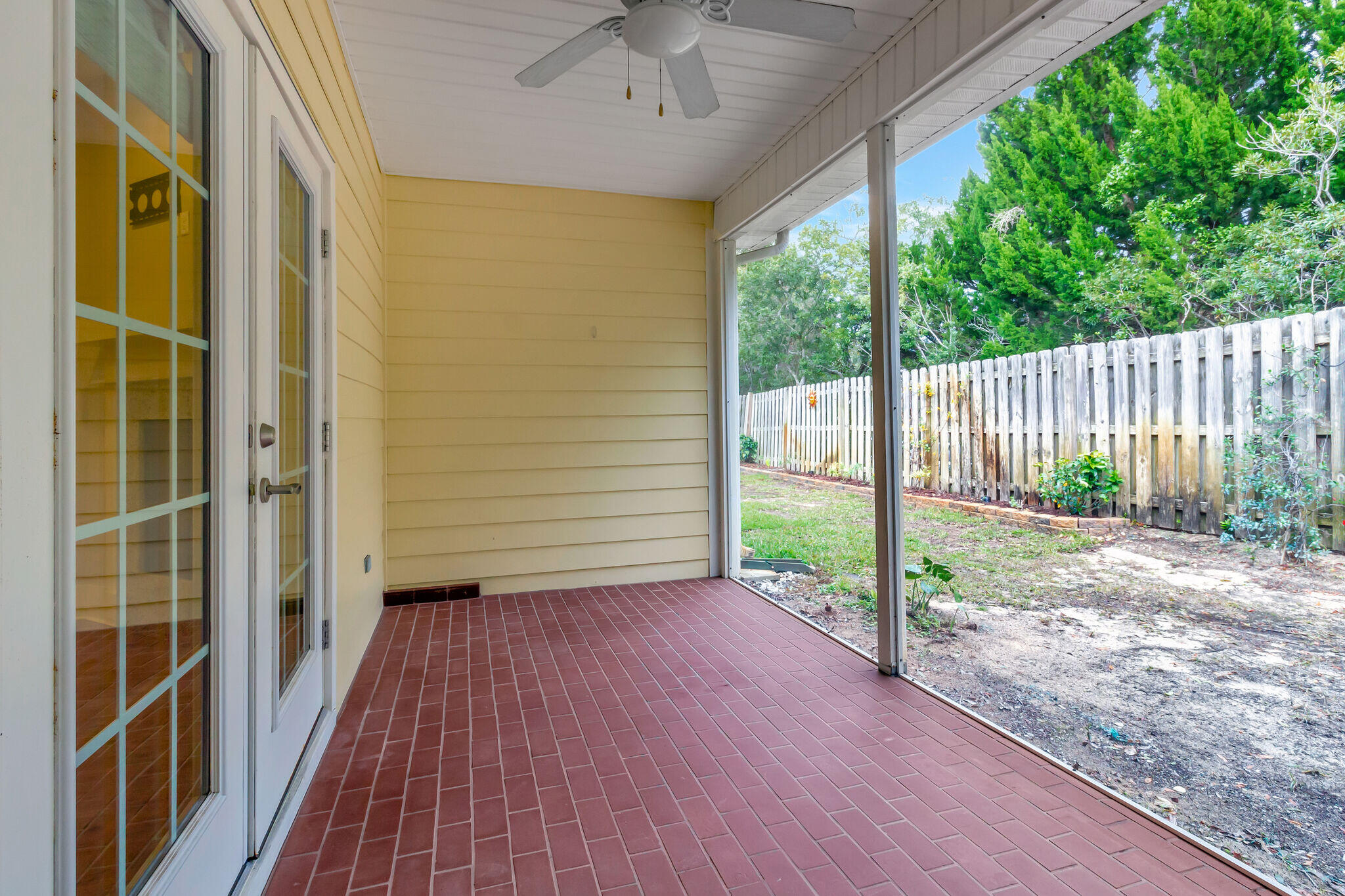 4232 Jade Loop Destin, FL 32541 - Photo 30 of 34 a view of a porch with wooden floor and fence