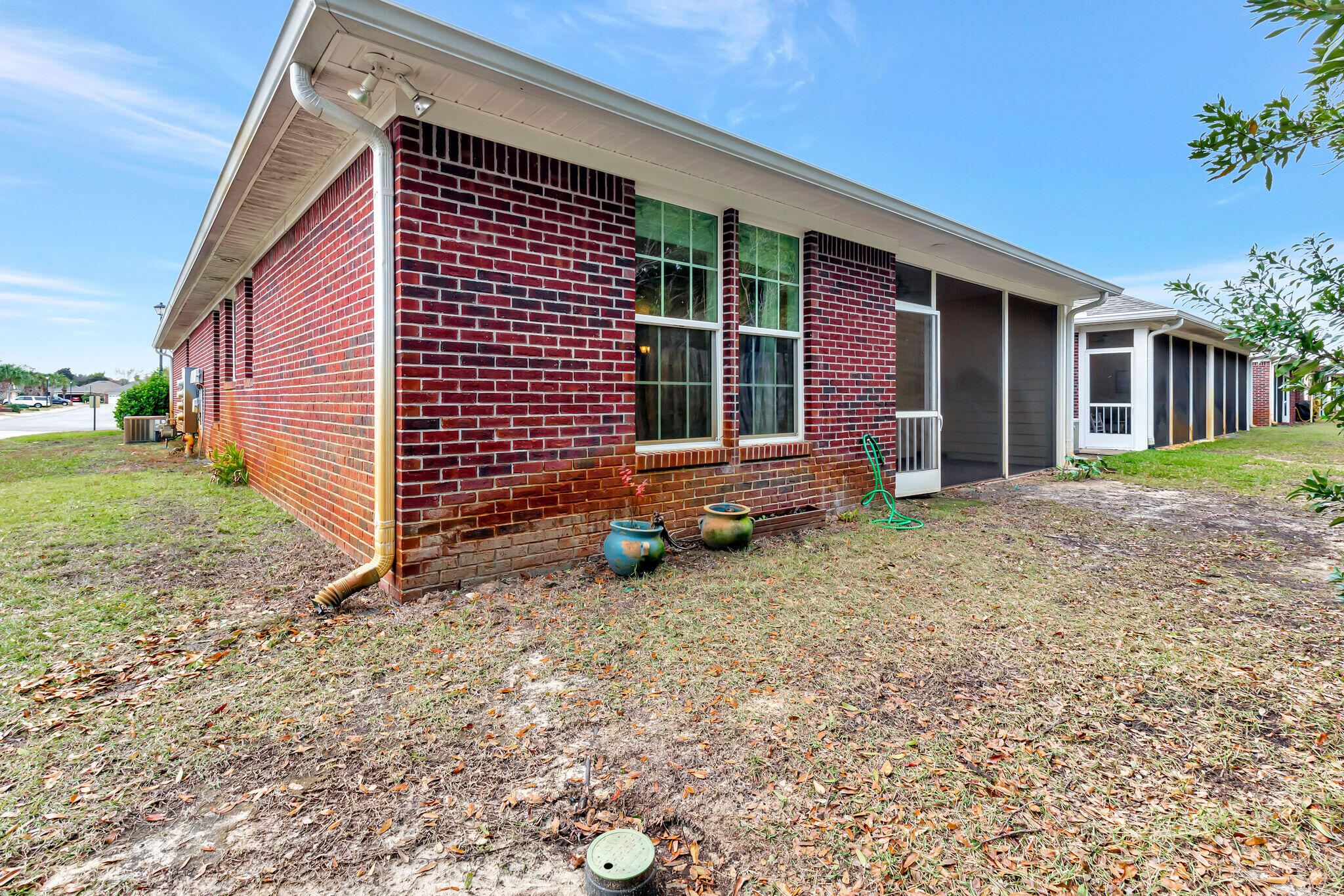 4232 Jade Loop Destin, FL 32541 - Photo 31 of 34 a front view of a house with garden