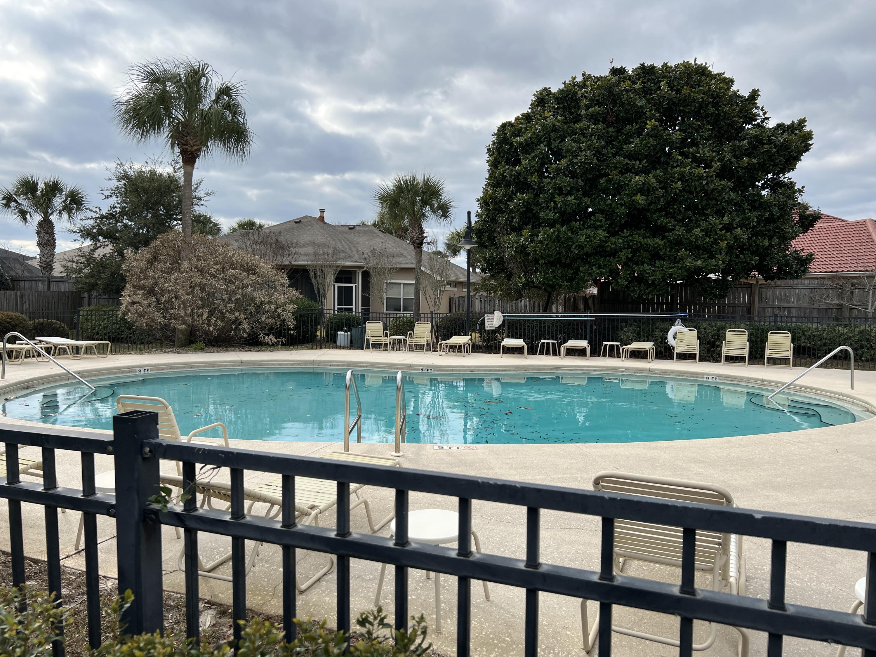 4232 Jade Loop Destin, FL 32541 - Photo 33 of 34 a view of swimming pool with outdoor seating and plants