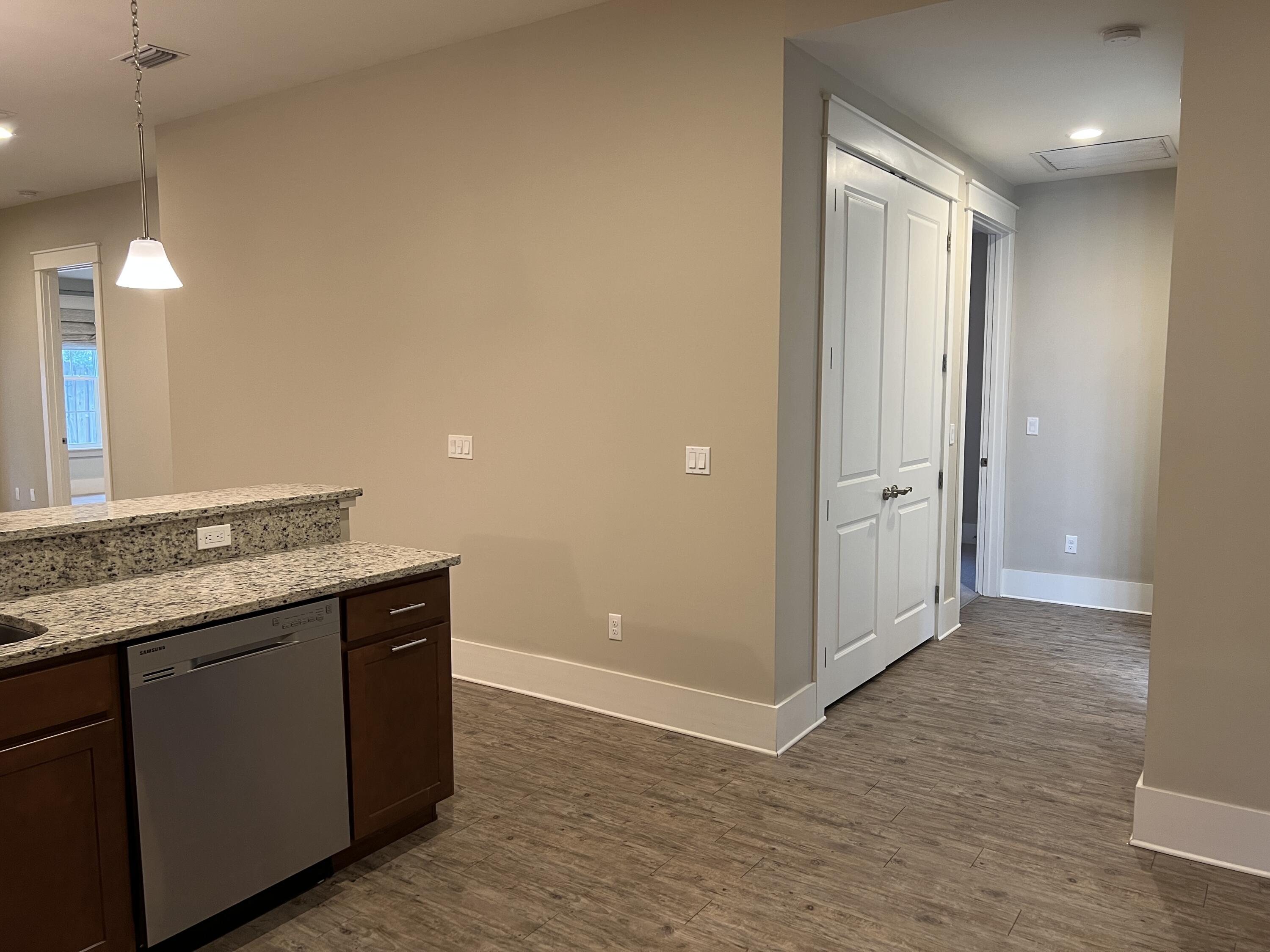4232 Jade Loop Destin, FL 32541 - Photo 7 of 34 a view of a kitchen cabinets a sink and dishwasher in a room