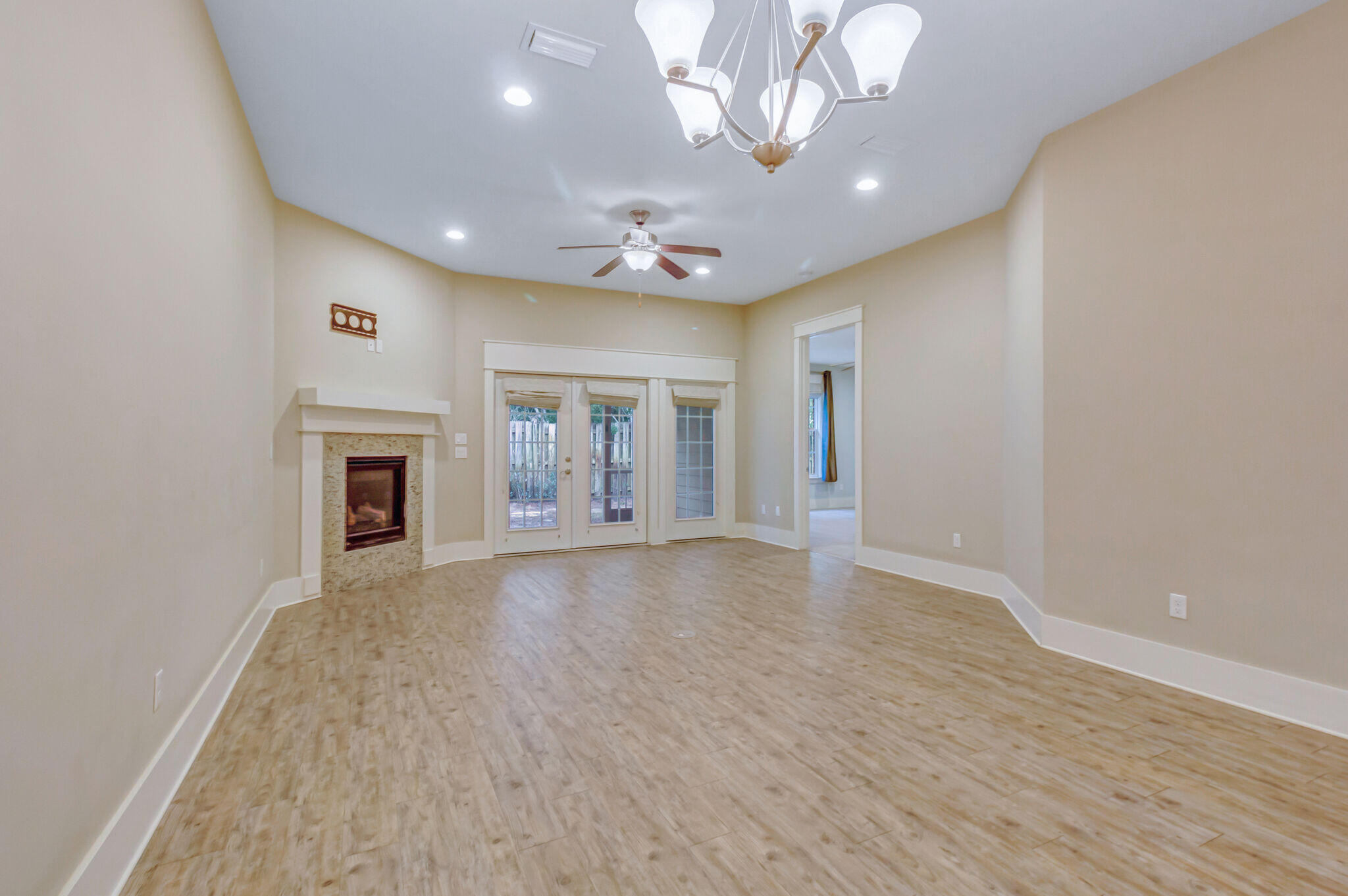 4232 Jade Loop Destin, FL 32541 - Photo 9 of 34 wooden floor in an empty room with a window