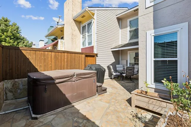 a view of a chairs and tables in the back yard of the house