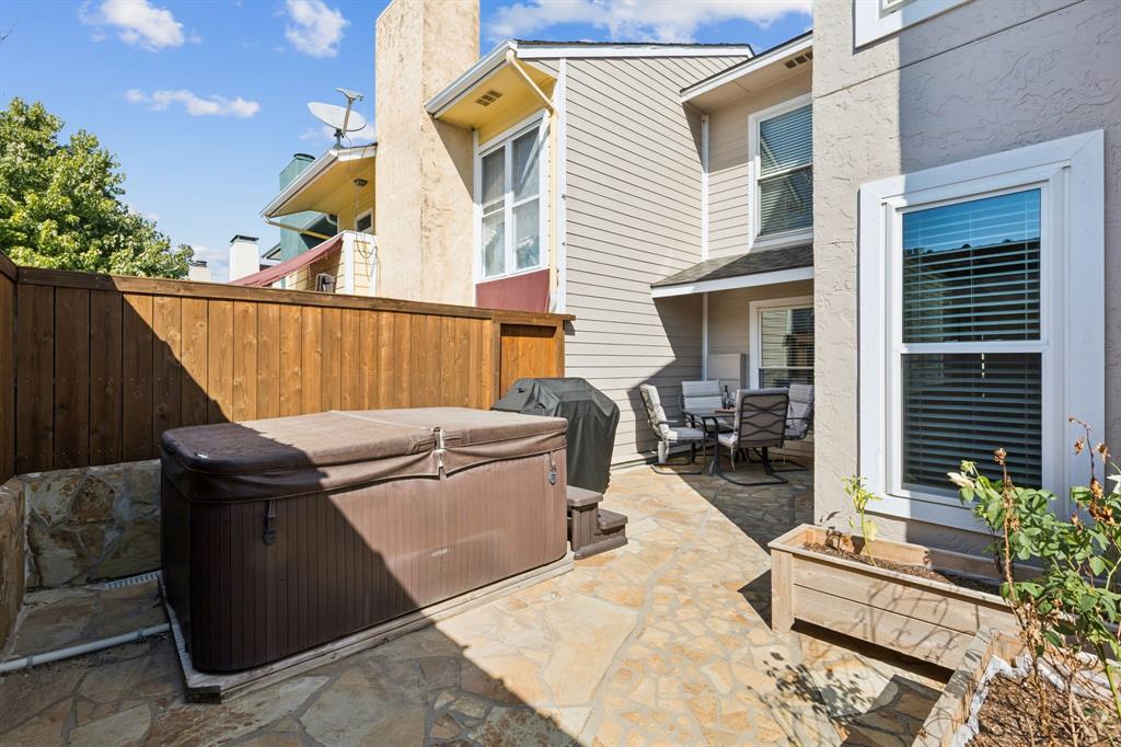 1641 Choteau Circle Grapevine, TX 76051 - Photo 11 of 29 a view of a chairs and tables in the back yard of the house