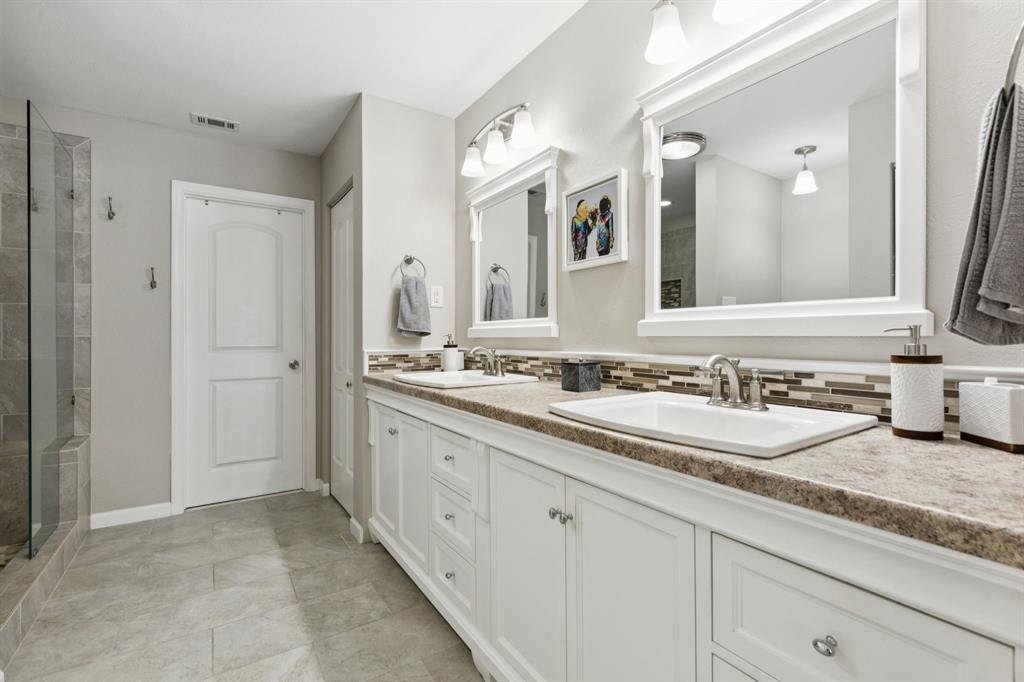 1641 Choteau Circle Grapevine, TX 76051 - Photo 19 of 29 a bathroom with a granite countertop double sink and a mirror