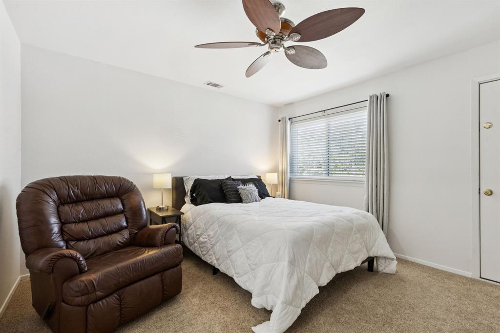 1641 Choteau Circle Grapevine, TX 76051 - Photo 20 of 29 a bedroom with bed couch and window