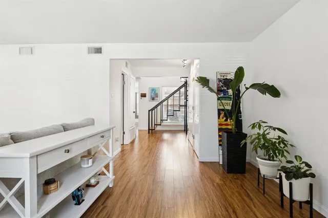 a view of entryway with wooden floor