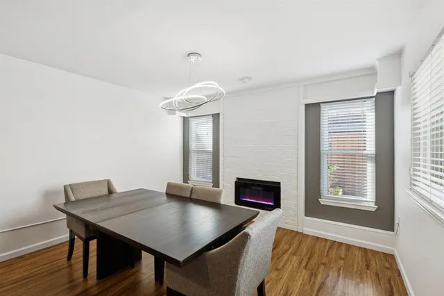 a view of a workspace with furniture and window