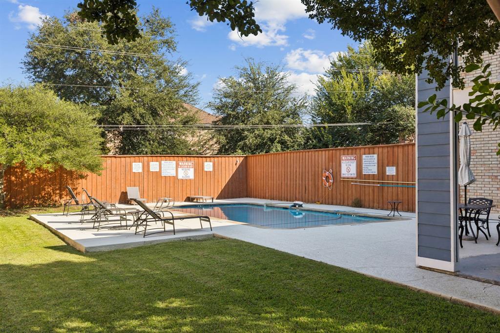 1641 Choteau Circle Grapevine, TX 76051 - Photo 27 of 29 a view of a swimming pool with a yard