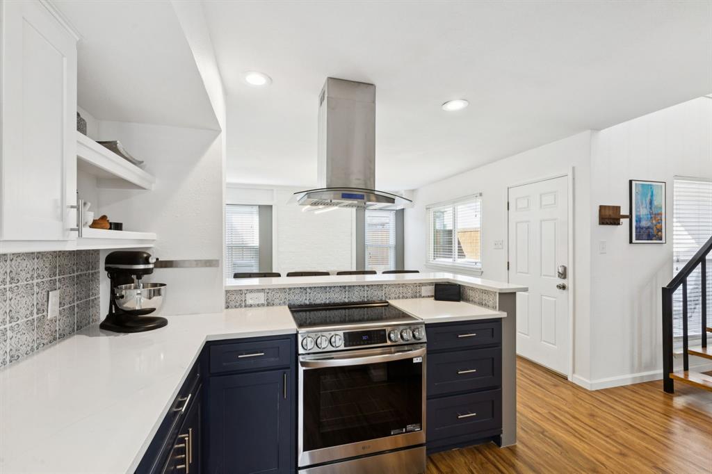 1641 Choteau Circle Grapevine, TX 76051 - Photo 3 of 29 a kitchen with stainless steel appliances granite countertop a stove and a sink