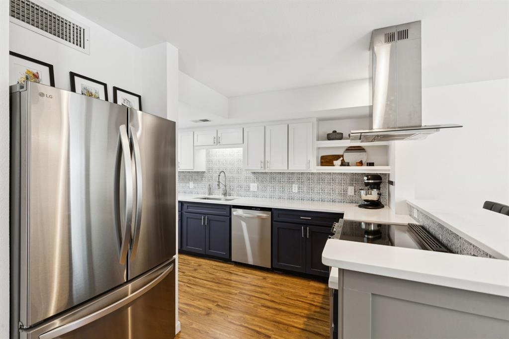 1641 Choteau Circle Grapevine, TX 76051 - Photo 9 of 29 a kitchen with stainless steel appliances granite countertop a refrigerator sink and cabinets
