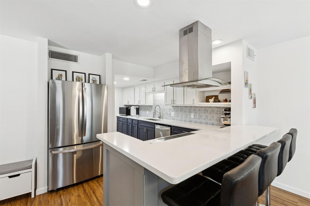1641 Choteau Circle Grapevine, TX 76051 - Photo 10 of 29 a kitchen with kitchen island a counter and a refrigerator
