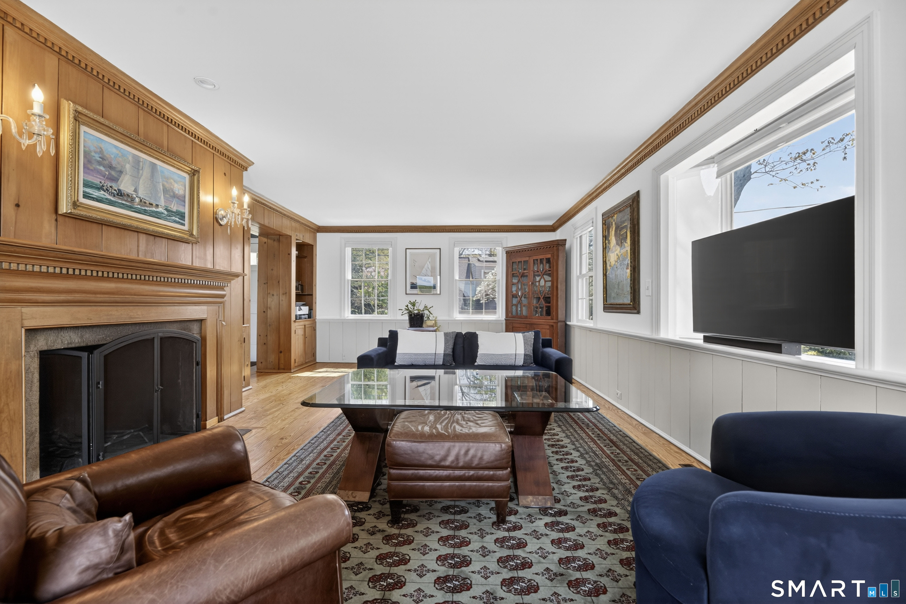 32 Money Point Road Stonington, CT 06355 - Photo 14 of 40 a living room with furniture a flat screen tv and a fireplace