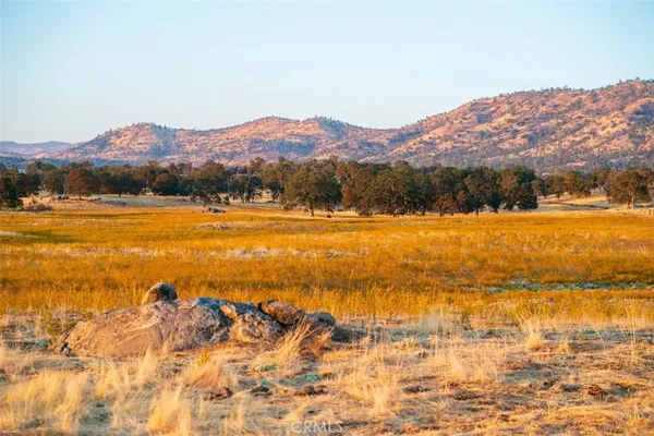a view of an ocean and a mountain