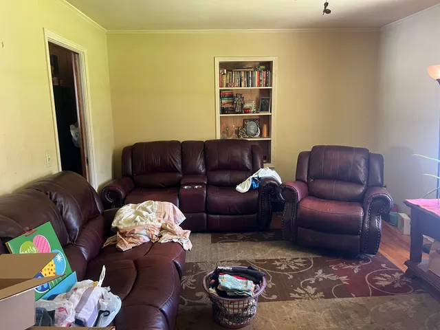 a living room with furniture and a couch