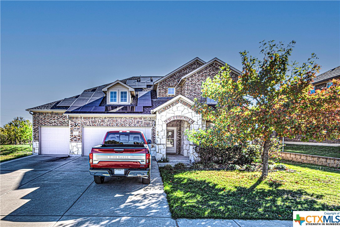 a car parked in front of yellow house