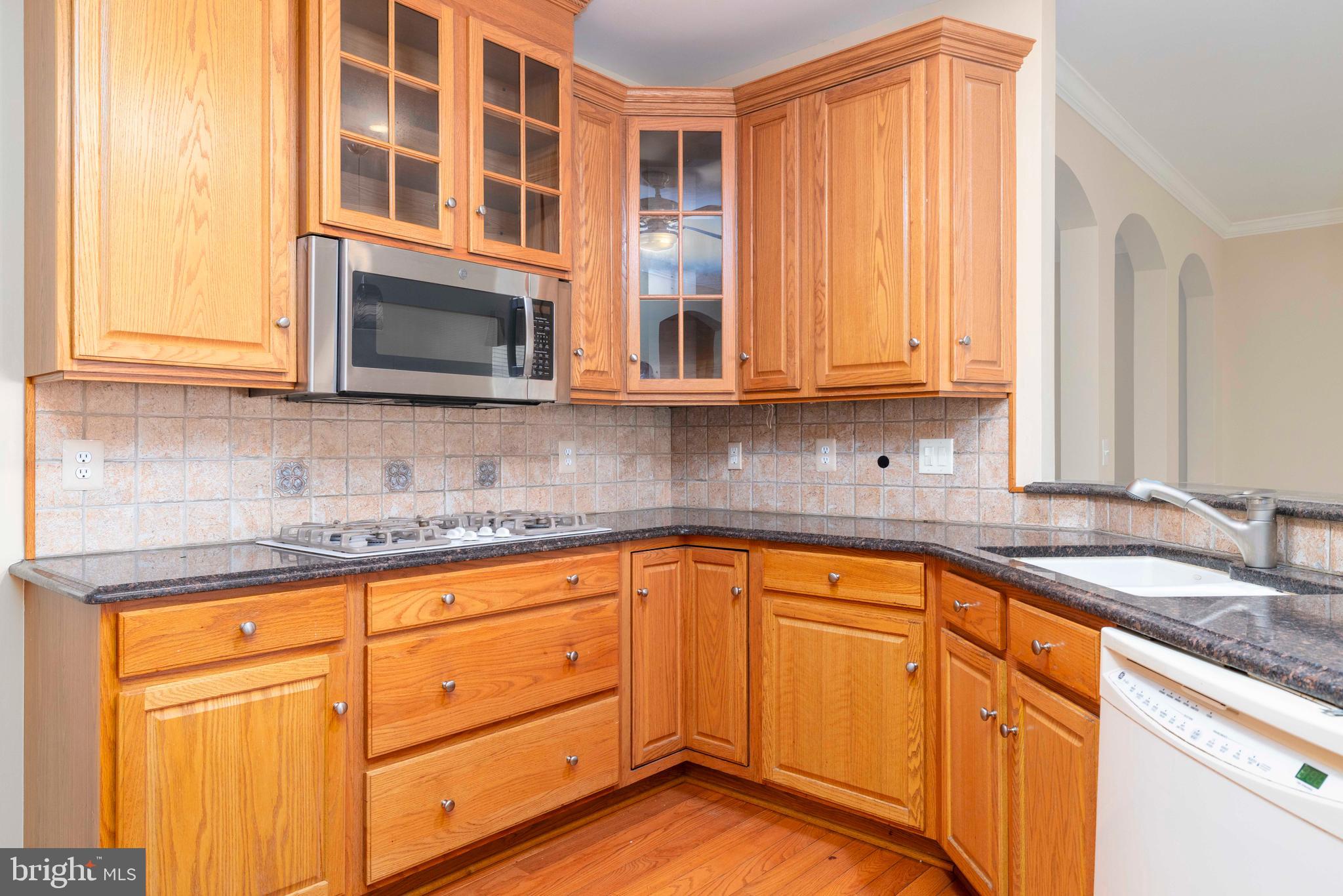 1028 Conway Court Warminster, PA 18974 - Photo 15 of 32 a kitchen with granite countertop cabinets stainless steel appliances a sink and window