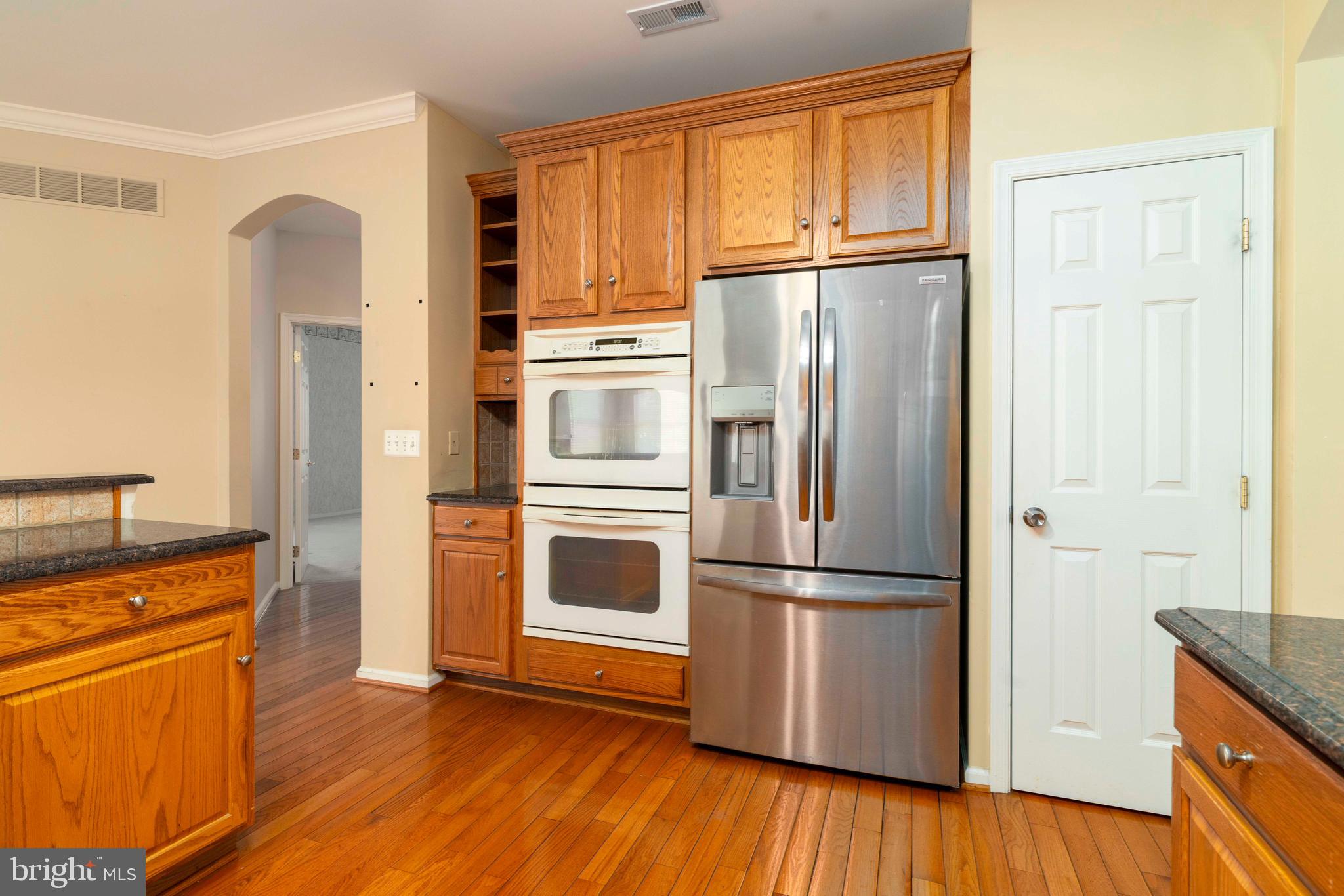 1028 Conway Court Warminster, PA 18974 - Photo 16 of 32 a kitchen with stainless steel appliances granite countertop a refrigerator microwave and stove top oven