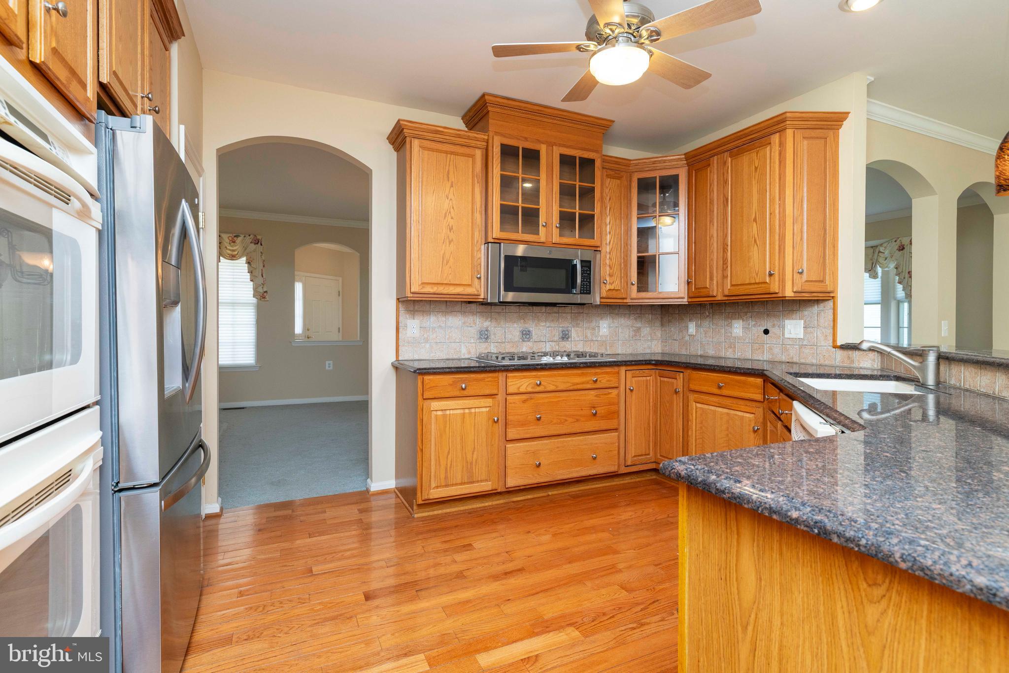 1028 Conway Court Warminster, PA 18974 - Photo 17 of 32 a kitchen with stainless steel appliances granite countertop a sink and cabinets